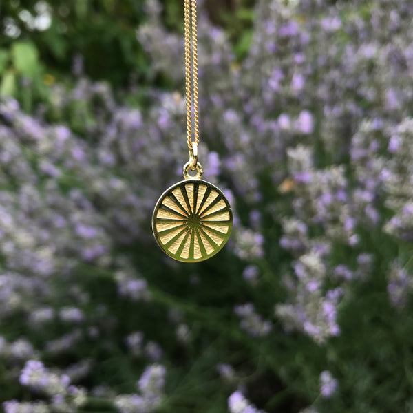 spinning wheel medallion in gold vermeil 